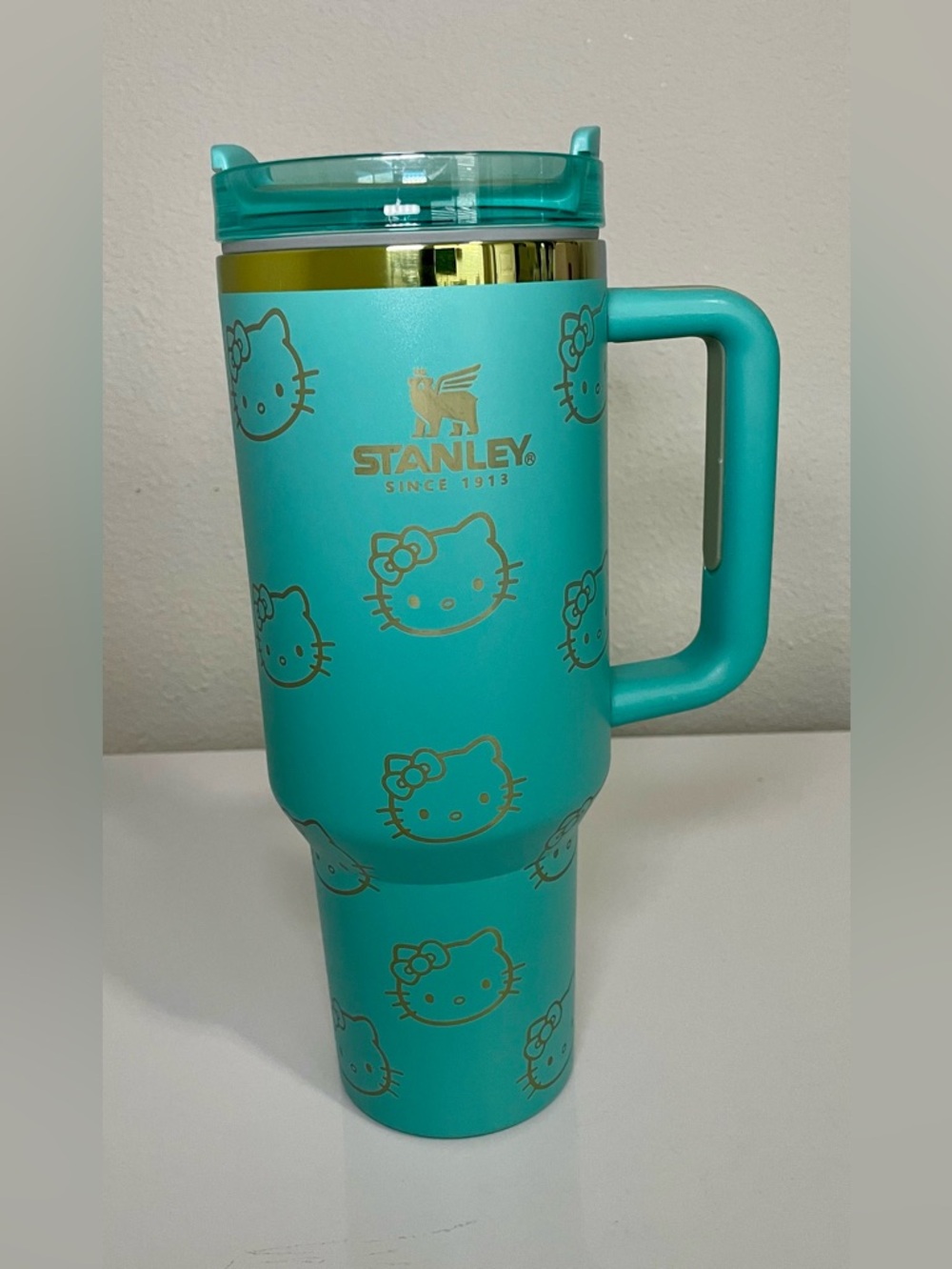 Stanley Turquoise Teal 40 oz Travel Mug w/ Gold Kitty Accents and rainbow rim